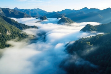 Naklejka na ściany i meble Majestic Aerial View of Serene Misty Mountains Shrouded in Mystical Fog - Nature's Breathtaking Beauty Captured from Above