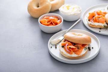 Plain bagel with salmon and cream cheese with fresh dill and capers