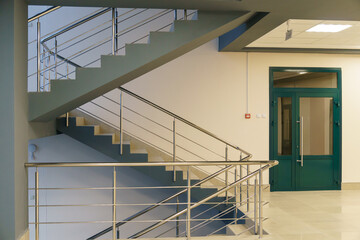 A spacious empty room with columns and no furniture. The concept of a comfortable office. The...