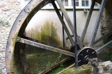 Old water wheel at Cockington village, Devon