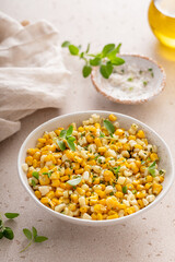 Sauteed yellow and white corn with herbs, healthy side dish idea