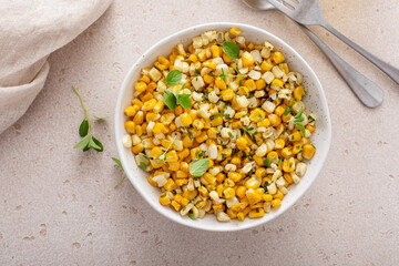 Sauteed yellow and white corn with herbs, healthy side dish idea