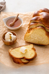 Freshly baked hallah sliced with butter and honey