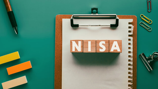 There is wood cube with the word NISA. It is an abbreviation for Nippon Individual Savings Account as eye-catching image.