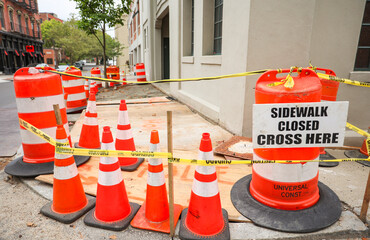 construction cones line streets, embodying urban evolution, progress, caution, and temporary transformation