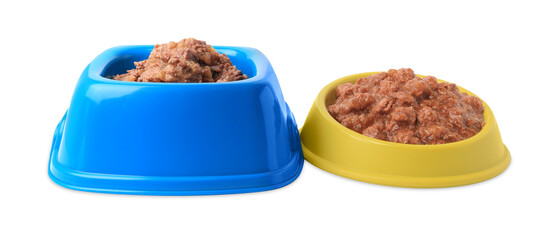 Wet pet food in feeding bowls on white background