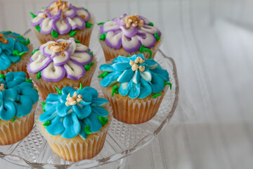 Blue and Purple frosted cupcakes decorated with gold dust