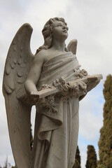 Angel Holding a Cross and Looking at Sky