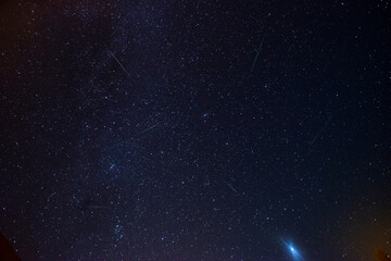 TUHINJ VALLEY, SLOVENIA - AUGUST 12, 2023: Perseid meteor shower, seen on the evening sky from Tuhinj valley in Slovenia