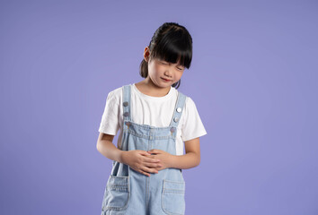 cute asian girl posing on purple background