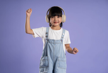 cute asian girl posing on purple background