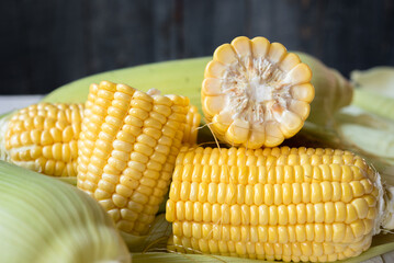 Fresh corn on rustic white wooden table, closeup