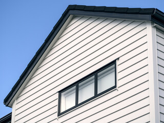 First floor of modern townhouse. Exterior view. Gable roof.