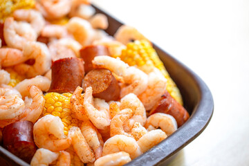 A Shrimp Bake with Sausage Corn on the Cob and Potatoes Baked Together with Southern Cajun Seasonings