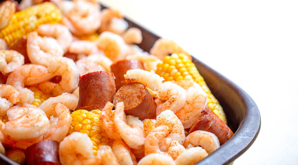 A Shrimp Bake with Sausage Corn on the Cob and Potatoes Baked Together with Southern Cajun Seasonings