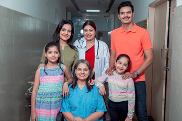 Indian family visiting his senior member or relative and giving best wish at hospital.