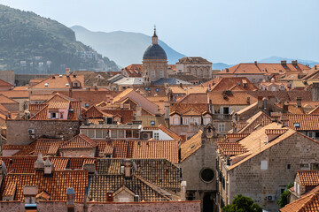 Fototapeta na wymiar Dubrovnik, Croatia 07-29-2023 The UNCESO world heritage old town of Dubrovnik with fortified walls with spectacular views from the walls over the old town, the narrow streets and the Adriatic sea.