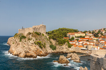 Fototapeta na wymiar Dubrovnik, Croatia 07-29-2023 The UNCESO world heritage old town of Dubrovnik with fortified walls with spectacular views from the walls over the old town, the narrow streets and the Adriatic sea.