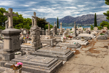 Cavtat, Croatia 07-26-2023 The historical cementary of the fishing village of Cavtat near Dubrovnik with the Family Racic's mausoleum on top of the hill