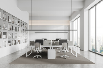 Office room interior with pc computers in row, shelf with panoramic window