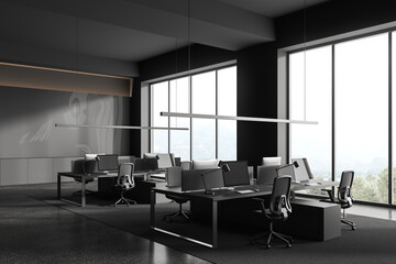 Fototapeta na wymiar Grey business interior with coworking corner near panoramic window