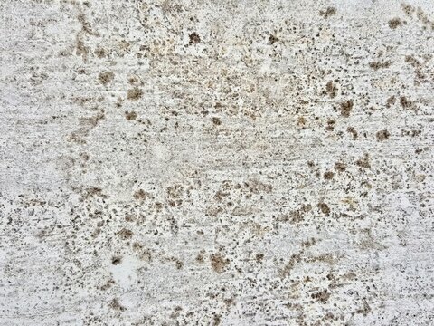 a photography of a white wall with a lot of dirt on it, nail marks on a concrete wall with a white background.