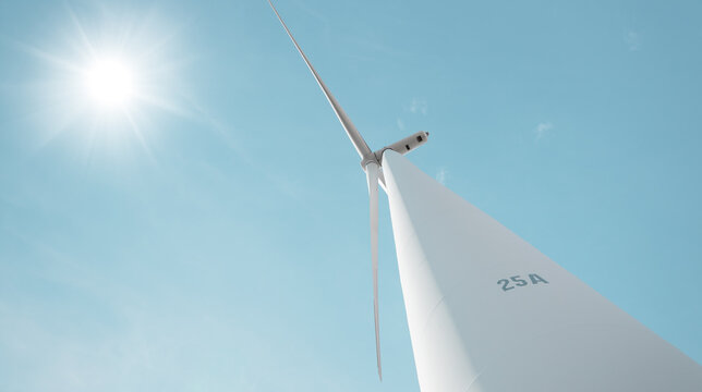 Wind turbine on sun light blue clear sky for clean energy eco power future sustainable electricity image concept
