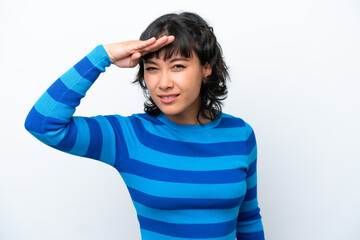 Young Argentinian woman isolated on white background looking far away with hand to look something