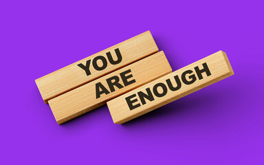 Wooden blocks with are you enough word on colorful isolated background 3d illustration