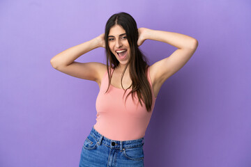 Young caucasian woman isolated on purple background laughing