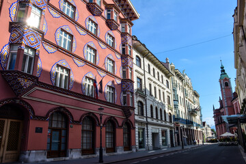 Fototapeta na wymiar The Cooperative Business Bank Building (or Vurnik House) and the Franciscan Church on Miklosich Street - Ljubljana, Slovenia
