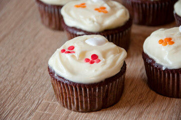 yummy chocolate muffin. sweet food. delicious cupcake food. yummy and sweet dessert. confectionery. birthday cake. frosting cupcake with cream. homemade cup cake with sprinkles. cupcake dessert