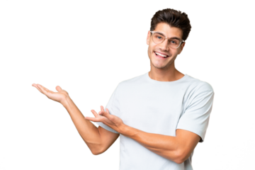 Young caucasian handsome man over isolated background extending hands to the side for inviting to come