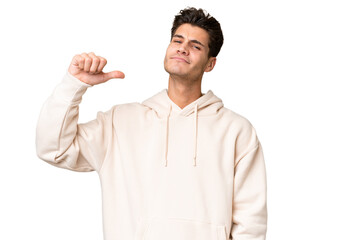 Young caucasian handsome man over isolated background proud and self-satisfied