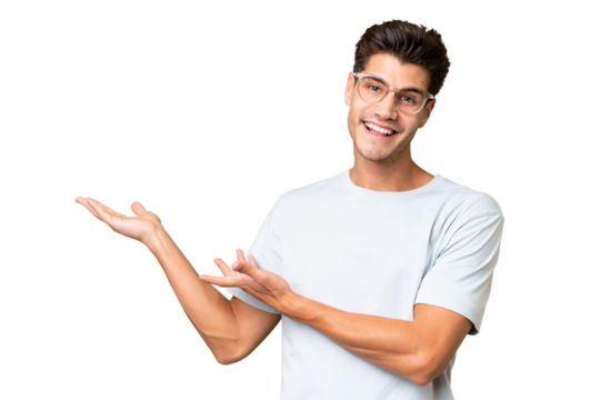 Young caucasian handsome man over isolated background extending hands to the side for inviting to come