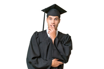Young university graduate caucasian man over isolated background surprised and shocked while looking right