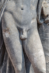 Potsdam, Germany - Ancient decayed statue of a bathing Renaissance Era man in the historical downtown of Potsdam, a German town of statues and sculptures, Germany