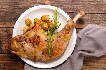 roasted lamb leg with potatoes and rosemary