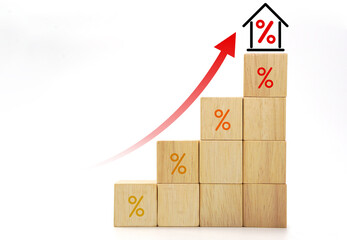 House interest rate with rising percentage and high up arrow icon on wooden blocks cube. Real...