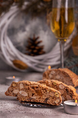Traditional italian Christmas New Year dry cookies biscuits biscotti cantuccini in glass bowl on wooden background. Biscotti di Prato.