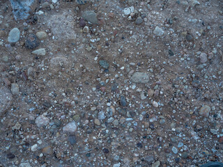 imagen detalle textura suelo de tierra y piedras de distintos tamaños 