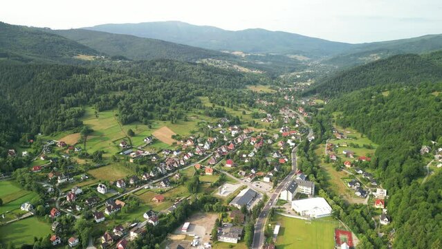 wide approach shot of the central and southern part of Zawoja with the Babia G&oacute;ra massif in the background, Lesser Poland, Poland