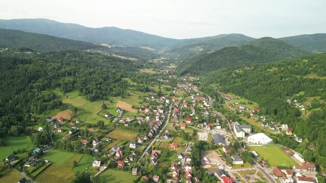 wide reveal shot of the central and southern part of Zawoja with the Babia G&oacute;ra massif in the background, Lesser Poland, Poland