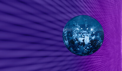 Party disco mirror ball reflecting magenta and dark blue lights  