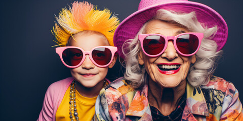 cool old grandmother with hat and grandson, crazy colorful lifestyle concept - obrazy, fototapety, plakaty