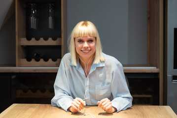 Businesswoman sitting at table and video calling on laptop. Woman video conferencing while working from home. Freelancer expatriate talking on webcam with clients, job search, employee application