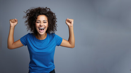 Young happy latin woman cheering at soccer sport match, blue t-shirt hispanic football fan...