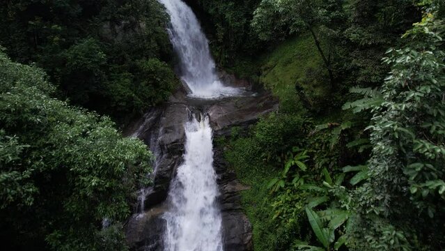 Aerial view. Waterfall hidden in tropical rainforest jungle in national park Doi Inthanon, Asia, Thailand.