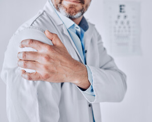 Doctor man, shoulder pain and hand with stress injury, fatigue and burnout at optometry job in...