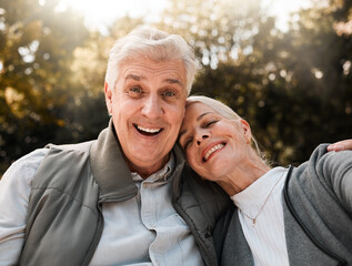 Happy, portrait and senior couple hug in a forest, love and bond in nature on a weekend trip together. Smile, face and romantic old woman embrace elderly male in woods, cheerful and enjoy retirement